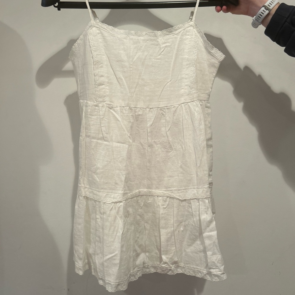 White Strappy dress.  New without tags.  Buttons at the neck in the back
